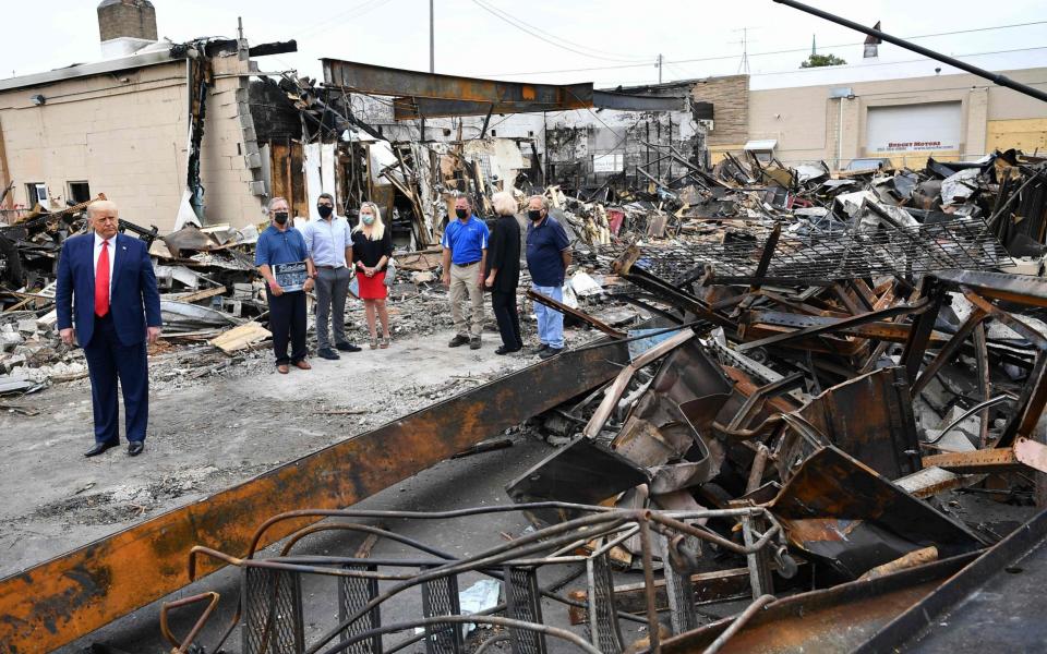 Donald Trump tours an area affected by civil unrest in Kenosha, Wisconsin  - AFP