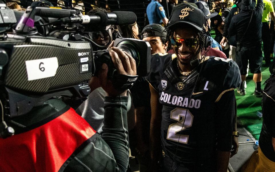 CU football’s junior quarterback Shedeur Sanders is all smiles while being interviewed on ESPN after a thrilling overtime victory against CSU in the Rocky Mountain Showdown on Sept. 16, 2023 at Folsom Field in Boulder, Colo.