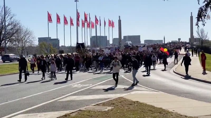 Demonstrators march to the Parliament House during a Black Lives Matter protest in Canberra