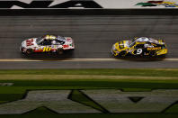 DAYTONA BEACH, FL - FEBRUARY 27: Greg Biffle, driver of the #16 3M Ford, leads Marcos Ambrose, driver of the #9 Stanley Ford, during the NASCAR Sprint Cup Series Daytona 500 at Daytona International Speedway on February 27, 2012 in Daytona Beach, Florida. (Photo by Streeter Lecka/Getty Images)