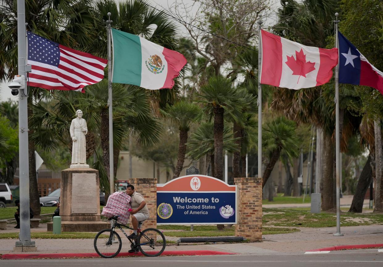 The flags of the United States, Mexico, Canada and Texas fly at the Gateway International Bridge in Brownsville Wednesday February 28, 2024.