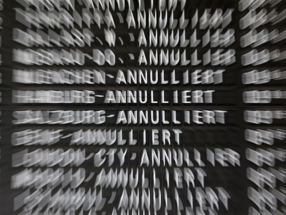 Cancelled flights appear on a board as public-sector employees of the Frankfurt airport went on a warning strike, demanding higher wages in Frankfurt, Germany, Thursday, March 27, 2014. Germany's largest airline Lufthansa alone said it was cancelling 600 flights Thursday, from primarily within Europe, as a result of the strike. (AP Photo/Michael Probst)