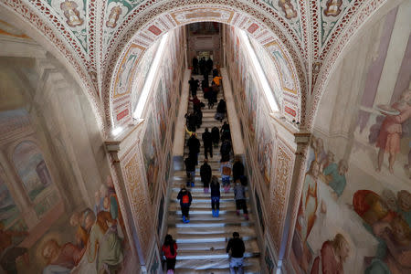 Worshippers pray on the Holy Stairs in Rome, Italy April 16 2019. REUTERS/Remo Casilli