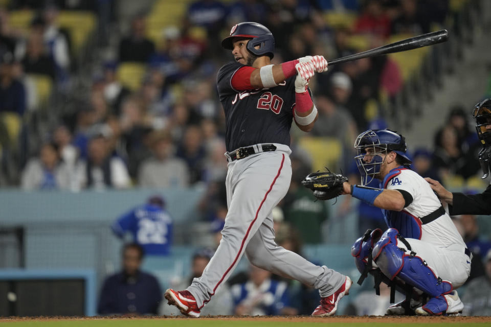 Washington Nationals' Keibert Ruiz (20) hits a home run during the seventh inning of a baseball game against the Los Angeles Dodgers in Los Angeles, Tuesday, May 30, 2023. (AP Photo/Ashley Landis)