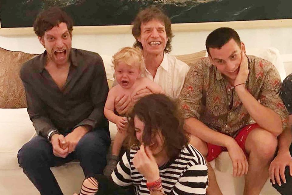 Jagger holding son Deveraux, now six, and three of his other boys (L-R) James, now 38, and Gabriel, now, 25, and Lucas, now 24 (Instagram)