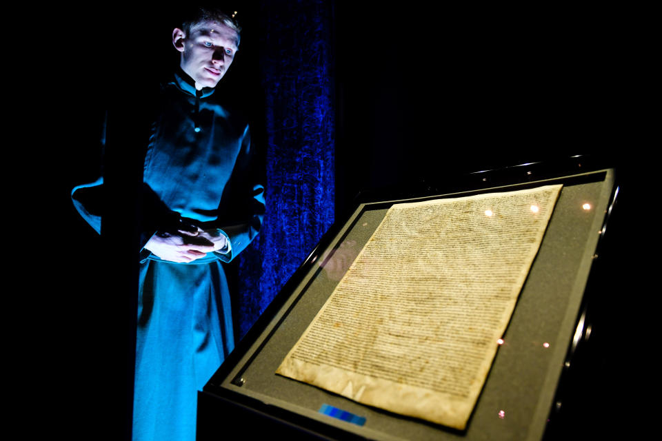 Salisbury Cathedral Verger Tyler Ringwood-Hoare, inspects the reinstalled original Magna Carta inside the medieval Chapter House, where it was attacked and had to be removed.