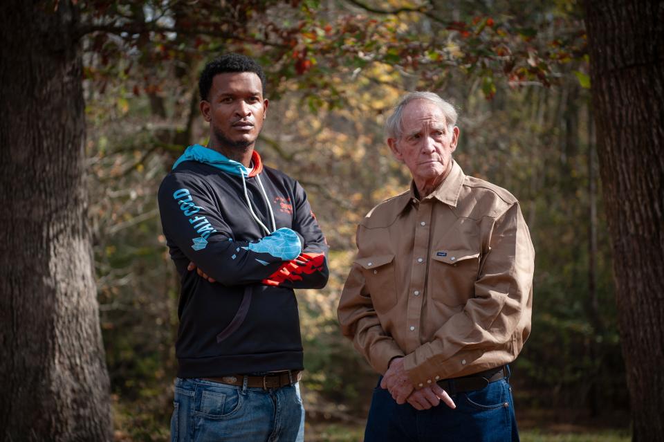 Christopher Holloway (left) and Sam Carter stand for a portrait outside Carter’s home in Pelahatchie, Mississippi on Nov. 24, 2023. Both allege they were beaten and tased at the house by the Rankin County Sheriff’s Department. Rory Doyle for The New York Times