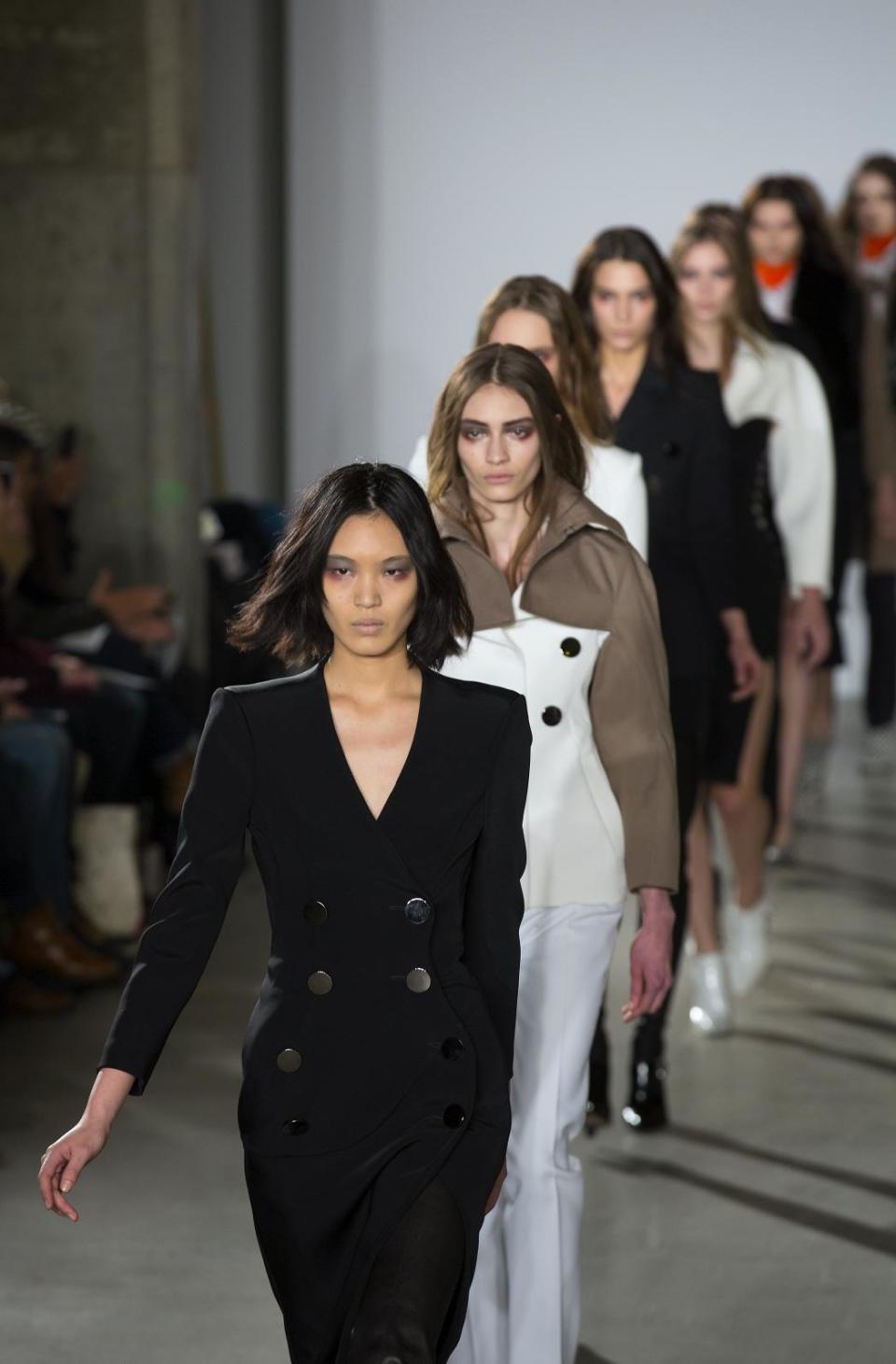 Models walk the runway at the presentation of the Altuzarra Fall 2013 fashion collection during Fashion Week, Saturday, Feb. 9, 2013, in New York. (AP Photo/Craig Ruttle)