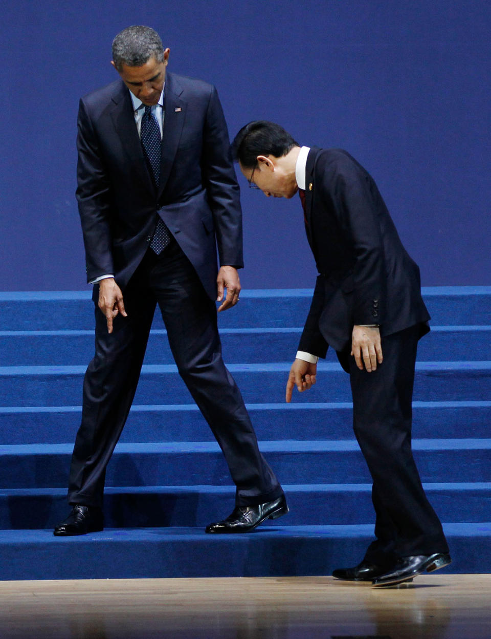 <p>President Barack Obama and South Korean President Lee Myung-bak, look for their marked positions on the floor as they arrive for a group photo session for the Nuclear Security Summit in Seoul, South Korea, Tuesday, March 27, 2012. (AP Photo/Pablo Martinez Monsivais) </p>