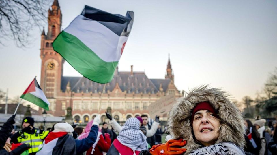 A Palestinian activist joins a rally prior to the hearing at the International Court of Justice (ICJ)