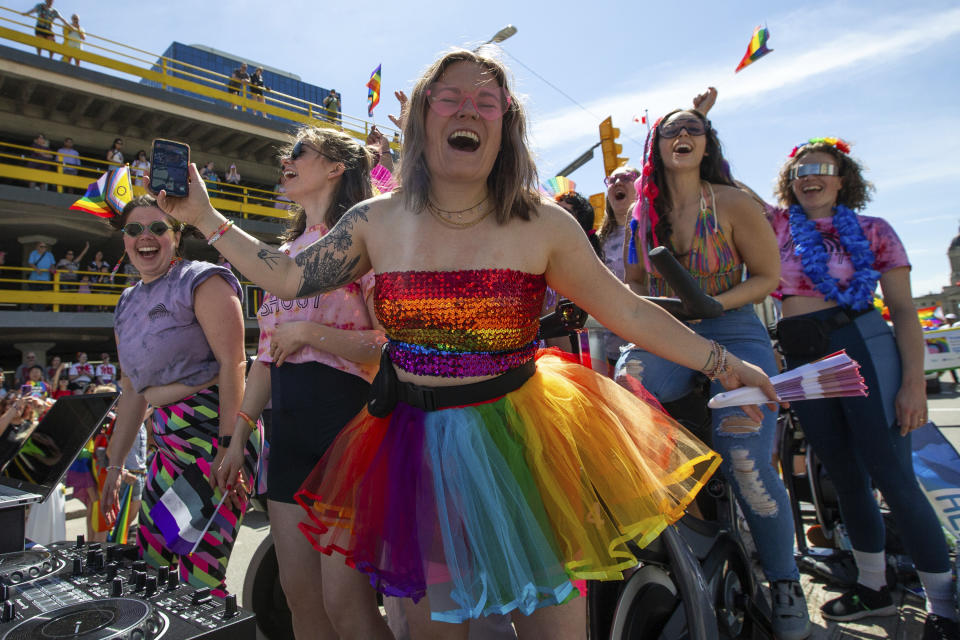 People take part in the Winnipeg Pride Parade, Sunday, June 2, 2024, in Winnipeg, Manitoba. (Daniel Crump/The Canadian Press via AP)