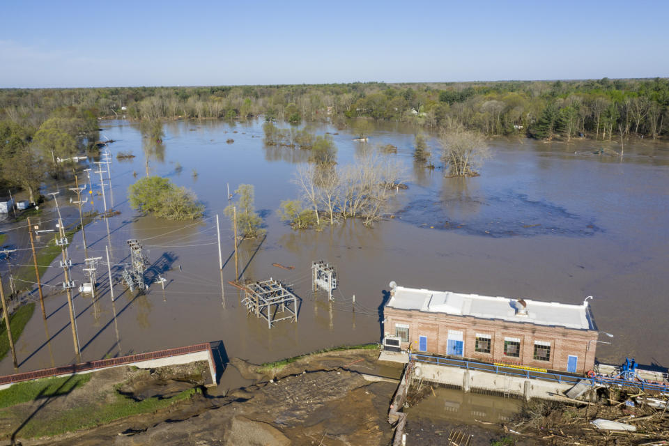 A look at the Sanford Dam on Wednesday, May 20, 2020. After the Edenville Dam failed and the Tittabawassee River flooded surrounding areas, many residents were urged to leave their homes and to brace themselves for the possibility of the Sanford Dam collapsing. Water flowed over the top of it through the night, but the structure is still in place. (Kaytie Boomer/The Bay City Times via AP)