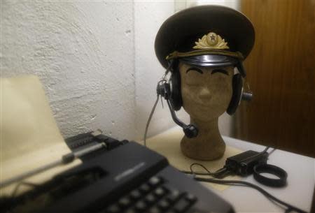 Headphones and a NVA helmet are seen on a styrofoam head at the 'Bunker-Museum' in Rennsteighoehe near the eastern city of Ilmenau October 12, 2013. REUTERS/Ina Fassbender