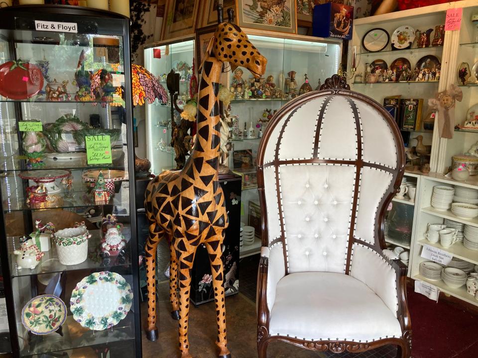 A 7-foot leather giraffe is among items being sold at Canton Preservation Society's Resale Store in the 1200 block of Tuscarawas Street W.