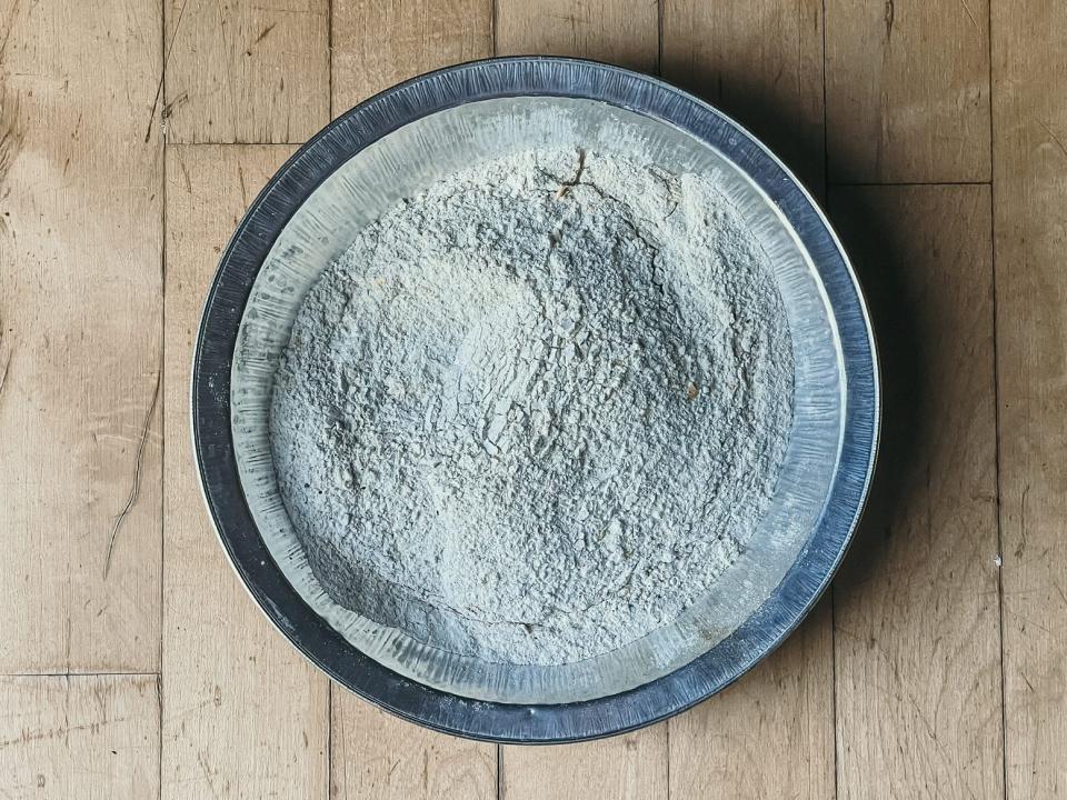 bowl of flour on a wooden surface