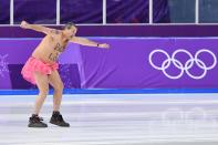<p>A shirtless man clad in a tutu dances on the rink following the men’s 1,000m speed skating event medal ceremony during the Pyeongchang 2018 Winter Olympic Games at the Gangneung Oval in Gangneung on February 23, 2018. / AFP PHOTO / Mladen ANTONOV </p>