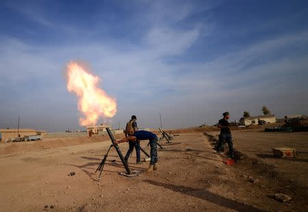 Federal police forces fire mortar toward Islamic State militants south of Mosul, Iraq, November 9, 2016. Picture taken November 9, 2016. REUTERS/Stringer