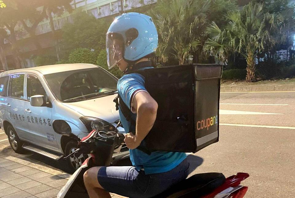 One of Coupang's delivery drivers on a scooter in Taipei, Taiwan