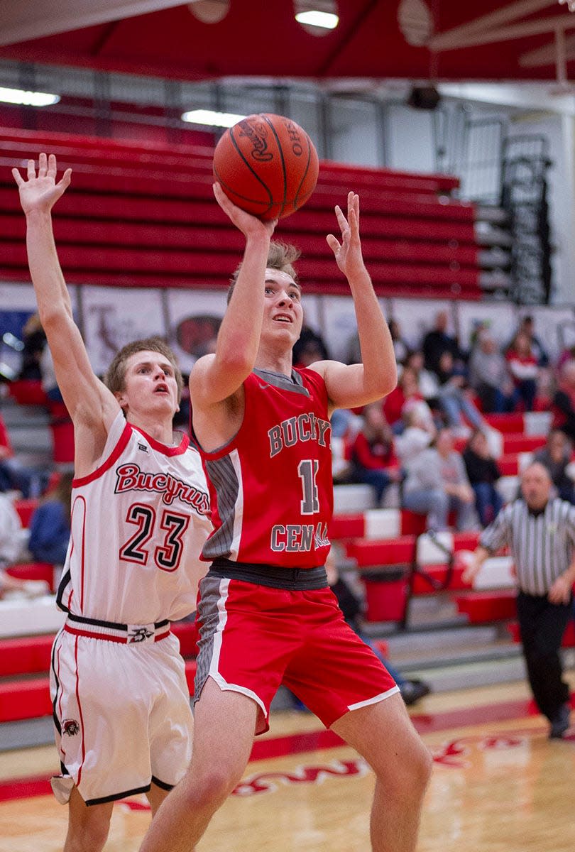 Buckeye Central's Tyler Sanderson shoots past Bucyrus' Malachi Bayless.