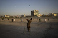 Afghans play cricket at the Chaman-e-Hozari Park in Kabul, Afghanistan, Friday, Sept. 17, 2021. (AP Photo/Bernat Armangue)