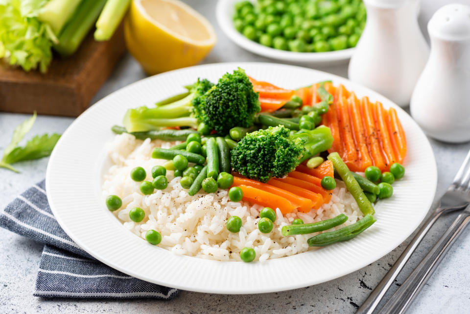 Rice with steamed vegetables. Healthy low calorie vegetarian meal