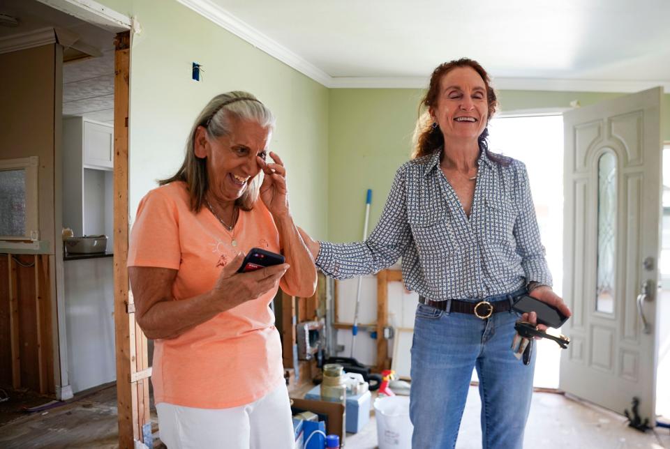 Rose Marie Powell, 83, left, wipes away a tear after being hugged by Penny Taylor at Moorhead Manor in Naples on Thursday, March 2, 2023. Taylor and the Baker Senior Center are using funds from the Collier Community Foundation to give Powell and four others a new manufactured home after theirs was destroyed in Hurricane Ian.