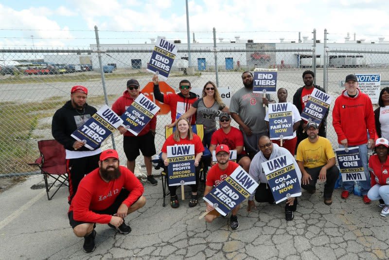 United Auto Workers Team 41 JL Assembly team pose for a photo as they strike outside an entrance to the Stellantis's factory where the Jeep Wrangler and Gladiator are built in Toledo, Ohio on Monday. Photo by Aaron Josefczyk/UPI