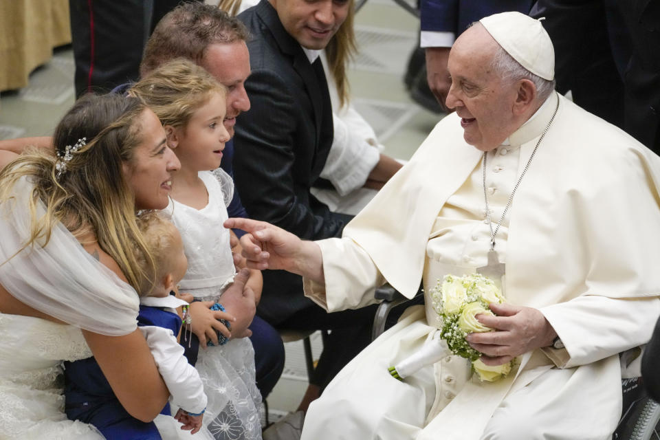 Pope Francis meets newly married couples during his weekly general audience in the Pope Paul VI hall at the Vatican, Wednesday, Aug. 30, 2023. (AP Photo/Andrew Medichini)
