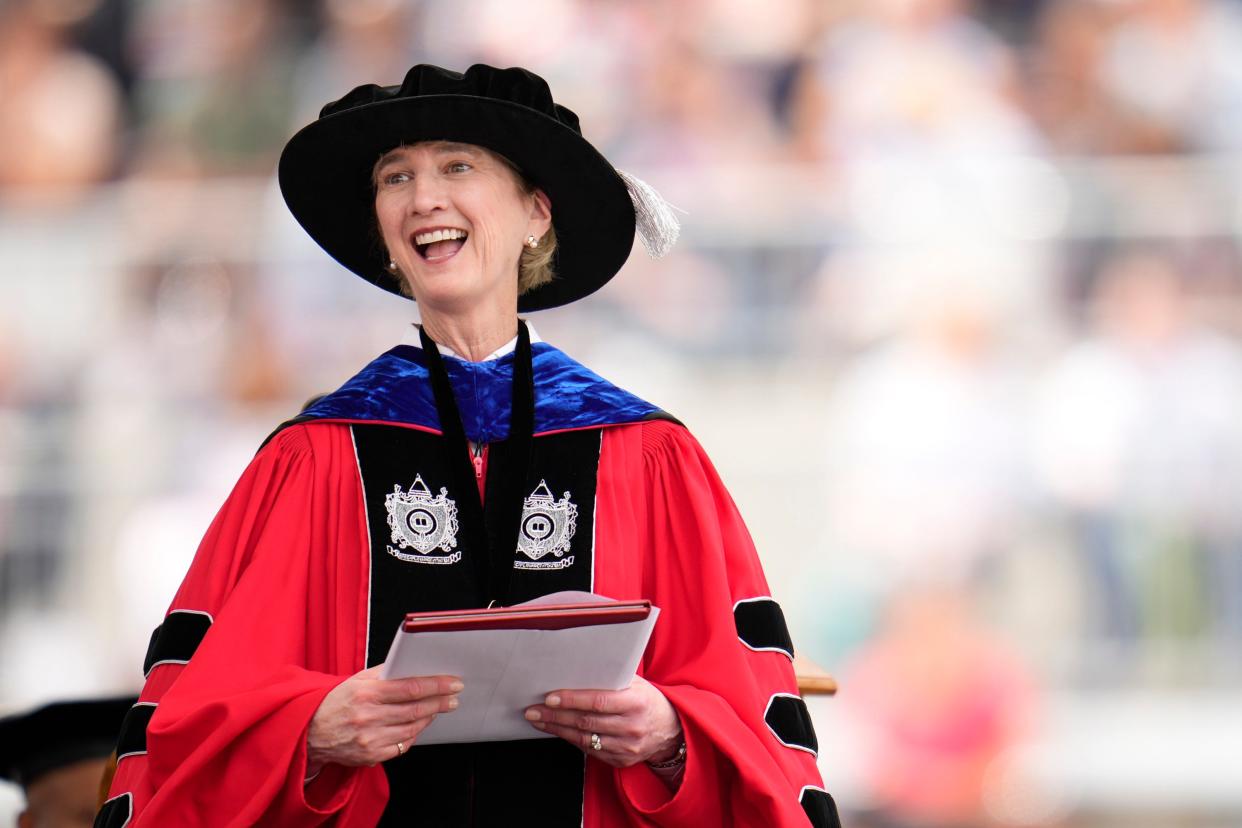Then Ohio State University President Kristina M. Johnson greets post-graduate students during Ohio State Spring Commencement ceremonies May 7 at Ohio Stadium.