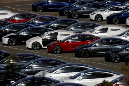 FILE PHOTO: Rows of the new Tesla Model 3 electric vehicles are seen in Richmond, California, U.S., June 22, 2018.    REUTERS/Stephen Lam/File Photo