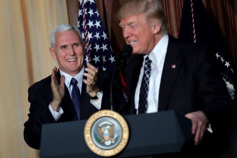 U.S. President Donald Trump reacts as he is introduced by Vice President Mike Pence during the signing of an executive order on "energy independence," eliminating Obama-era climate change regulations at the EPA headquarters