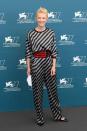 <p>Cate Blanchett accessorizes a grey and black striped jumpsuit with a large red belt at the 2020 Venice Film Festival on Wednesday. </p>