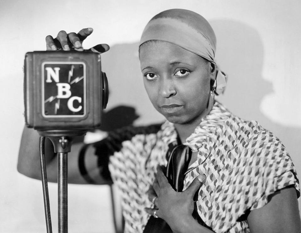 original caption ethel waters as radio entertainer in the 1920s she is standing next to nbc microphone undated photograph