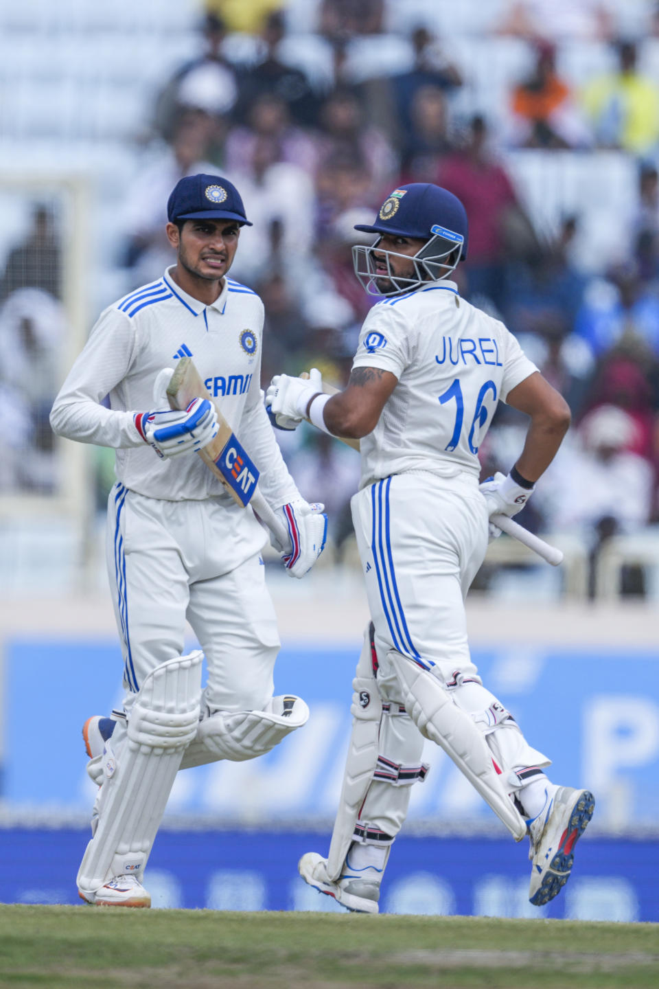 India's Shubman Gill, left and Dhruv Jurel run between the wickets on the fourth day of the fourth cricket test match between England and India in Ranchi, India, Monday, Feb. 26, 2024. (AP Photo/Ajit Solanki)