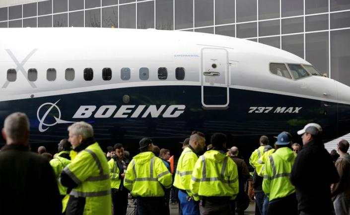 FILE PHOTO: Employees are pictured as the first Boeing 737 MAX 7 is unveiled in Renton
