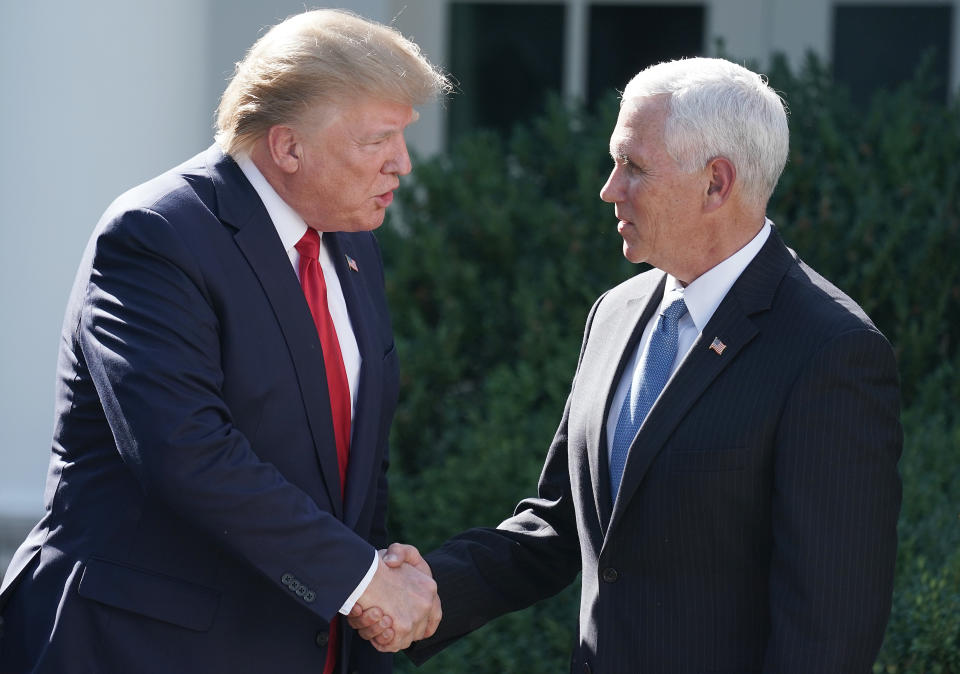 U.S. President Donald Trump (L) shakes hands with Vice President Mike Pence  at the White House August 29, 2019 in Washington, D.C. (Photo: Chip Somodevilla/Getty Images)