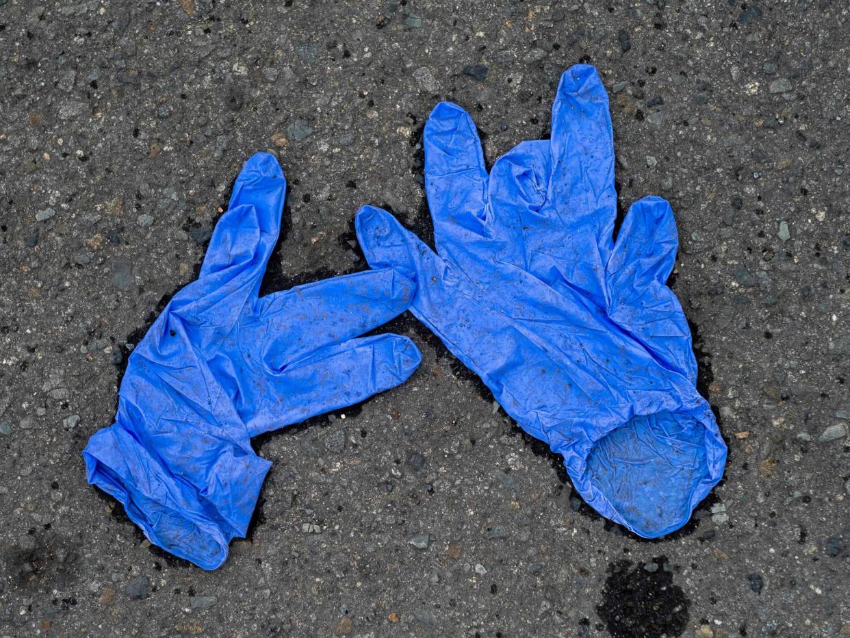 Latex gloves left outside of a grocery store: (Ricardo Arduengo AFP)