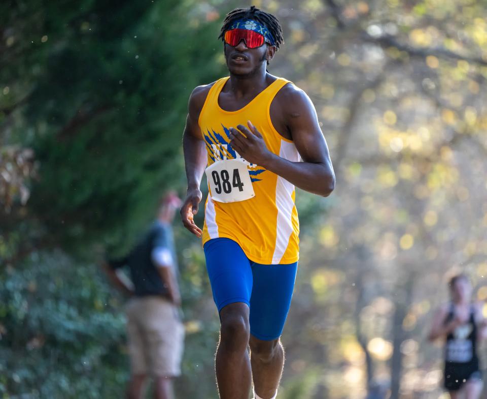 Alexis I. DuPont’s Lathan Love-Brown runs to a second place finish in the DIAA 2022 Cross Country Boy’s Division II Championship at Killens Pond State Park in Felton, Del.