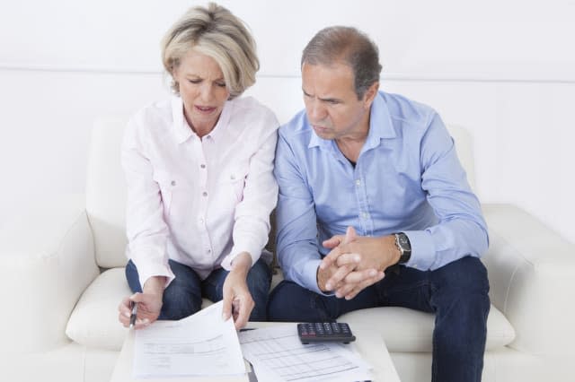 Couple doing family finances at home