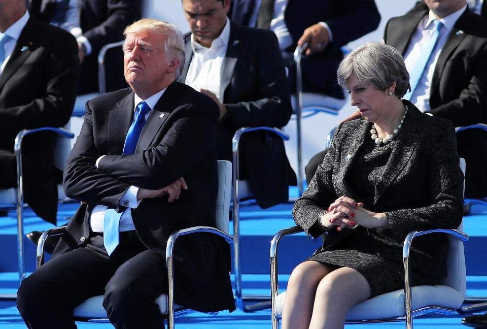 Trump and British Prime Minister Theresa May are pictured ahead of a photo opportunity of leaders as they arrive for a NATO summit meeting in Brussels, Belgium, on&nbsp;May 25.&nbsp;