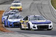 Chase Elliott makes his way around a turn during a NASCAR Cup Series auto race Sunday, July 3, 2022, at Road America in Elkhart Lake, Wis. (AP Photo/Morry Gash)