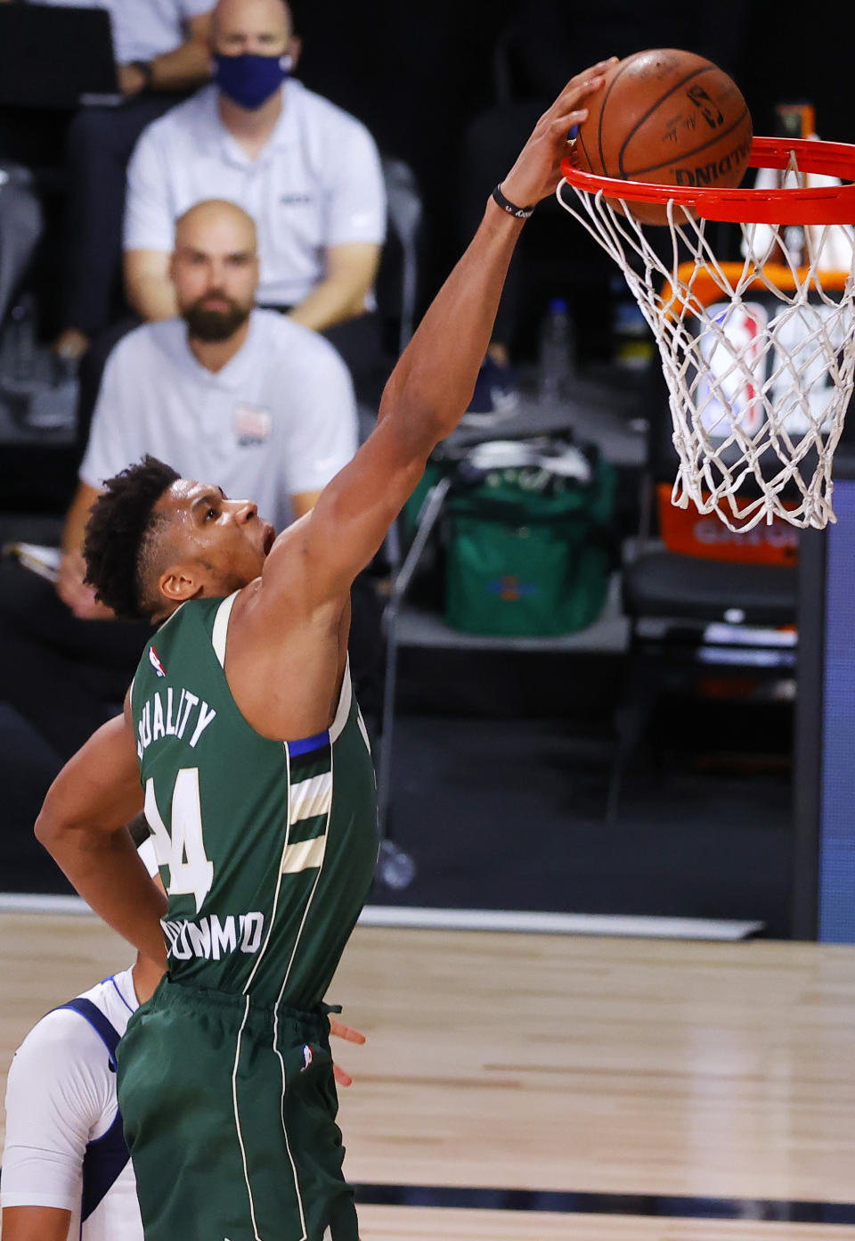 Milwaukee Bucks' Giannis Antetokounmpo dunks against the Dallas Mavericks during an NBA basketball game Saturday, Aug. 8, 2020, in Lake Buena Vista, Fla. (Kevin C. Cox/Pool Photo via AP)