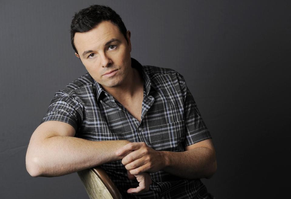 FILE - This June 16, 2012 photo shows Seth MacFarlane posing for a portrait at The Four Seasons Hotel in Beverly Hills, Calif. Early reviews for Seth MacFarlane's Oscar-hosting skills are very positive. The Academy Awards won't be presented until Sunday, Feb. 24, 2013, but MacFarlane won laughs from the show's director during a rehearsal Thursday, Feb. 21, inside the Dolby Theatre. (Photo by Chris Pizzello/Invision/AP)