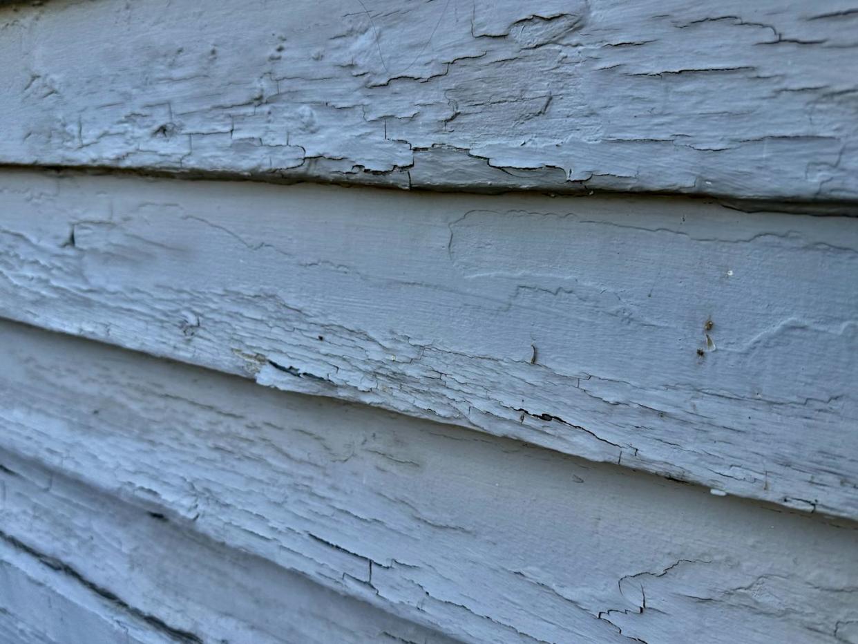 When lead-based paint blisters and cracks, lead dust may be released in the air. <a href="https://www.gettyimages.com/detail/photo/lead-based-paint-abatement-royalty-free-image/1735464372?phrase=lead%2Bpoisoning%2B" rel="nofollow noopener" target="_blank" data-ylk="slk:Douglas Rissing/iStock via Getty Images Plus;elm:context_link;itc:0;sec:content-canvas" class="link ">Douglas Rissing/iStock via Getty Images Plus</a>