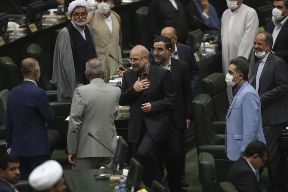 Mohammad Bagher Qalibaf, center, greets lawmakers after being elected as speaker of the parliament, in Tehran, Iran, Thursday, May 28, 2020. Iran's parliament elected Qalibaf, a former mayor of Tehran tied to the Revolutionary Guard, as its next speaker Thursday, solidifying hard-line control of the body as tensions between the U.S. and the Islamic Republic remain high over its collapsed nuclear deal. (AP Photo/Vahid Salemi)