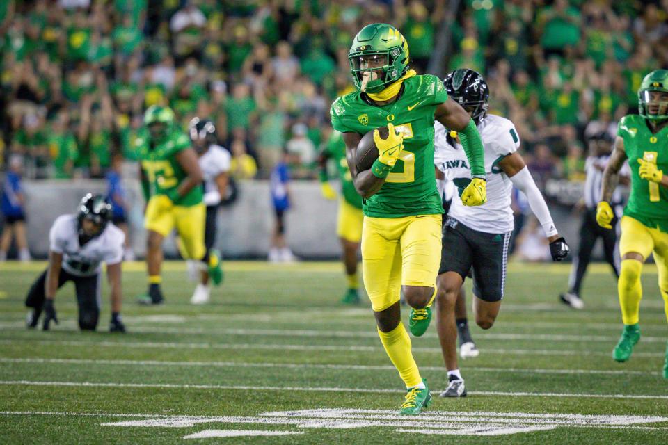 Oregon wide receiver Traeshon Holden takes off for a touchdown as the Oregon Ducks host Hawaii Saturday, Sept. 16, 2023, at Hayward Field in Eugene, Ore.