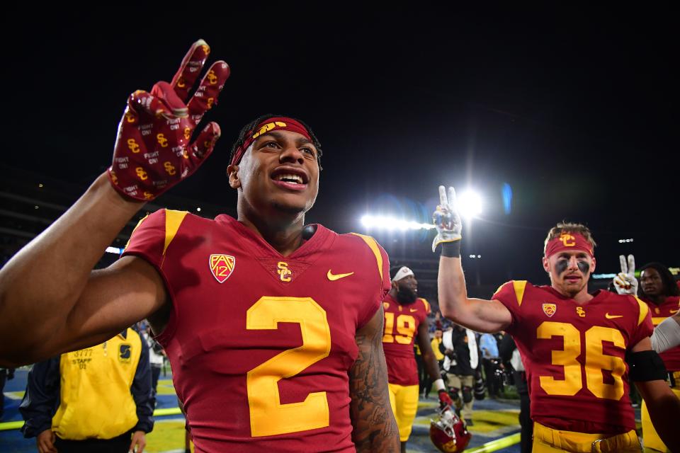 USC receiver Brenden Rice (2) and punter Will Rose (36) celebrate a victory over UCLA.