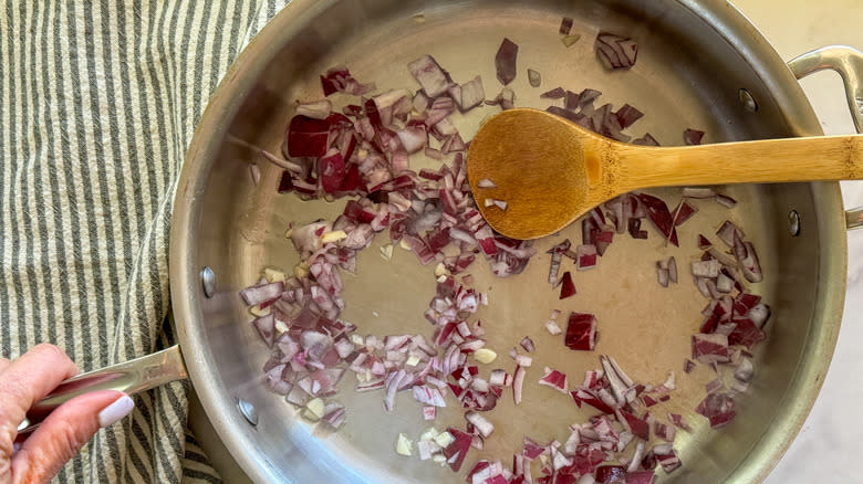 onion and garlic cooking in pan