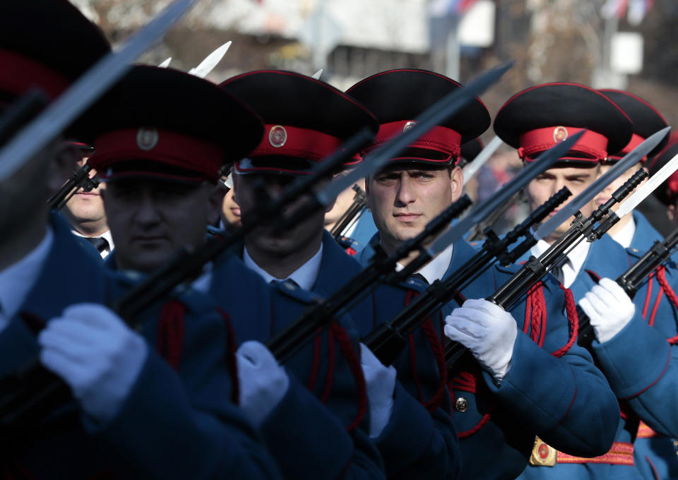 Members of the police forces of the Republic of Srpska march during a parade marking the 27th anniversary of the Republic of Srpska in the Bosnian town of Banja Luka, Wednesday, Jan. 9, 2019. In a show of nationalist defiance, Bosnian Serbs are celebrating a controversial holiday despite strong opposition from other ethnic groups in Bosnia who view it as discriminatory. Waving Serb flags, several thousand people on Wednesday lined up in the main Serb city of Banja Luka to watch a celebratory parade of security troops, firefighters, cultural and sport groups. (AP Photo/Amel Emric)