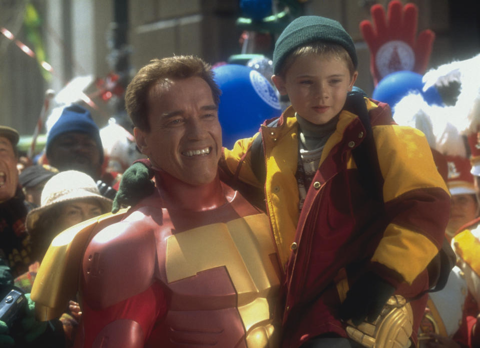 Actor Arnold Schwarzenegger with Jake Lloyd on the set of the film 'Jingle All the Way,' directed by Brian Levant